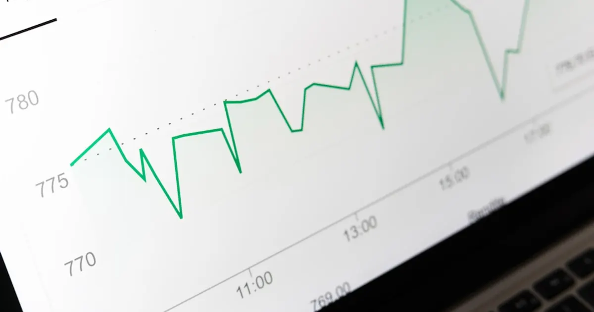 Stock market chart displayed on laptop screen