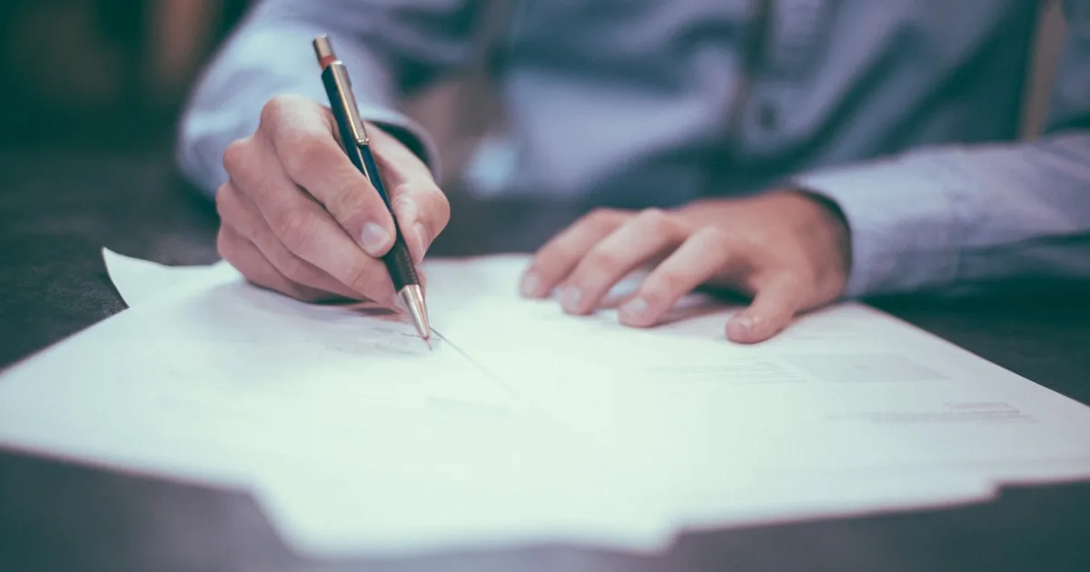 Home services business owner reviewing marketing budget spreadsheet for 2027 planning