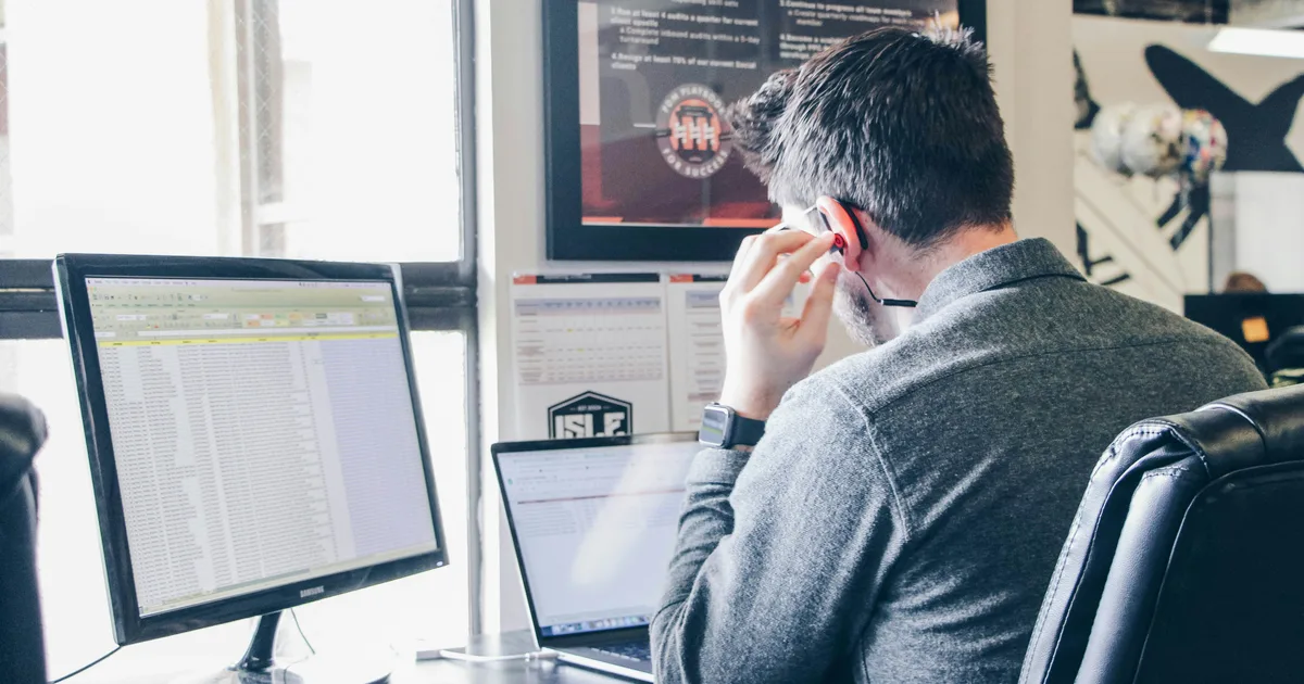 HVAC company owner reviewing marketing reports on a laptop